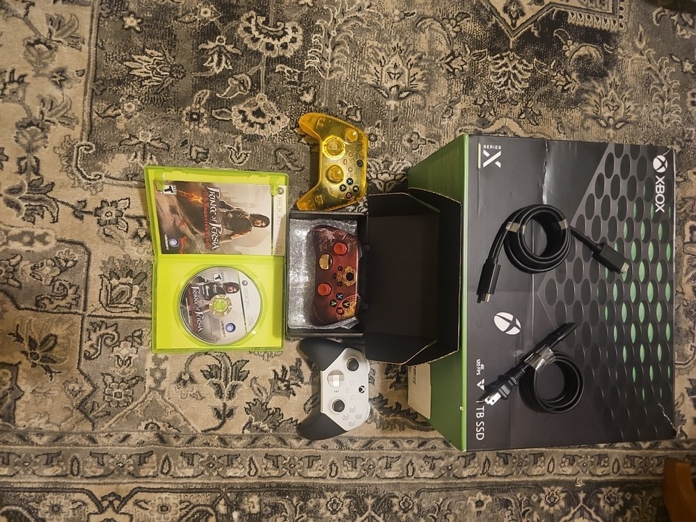 Xbox series x with three controllers in open box. condition