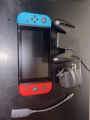 Includes Nintendo, Nintendo Controller Holder, Charger, Tv Adapter, And 6 Games
