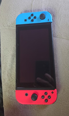 Nintendo Switch 32GB Console w/ Neon Red/Blue Joy-Con Dock 2 Pro Controllers