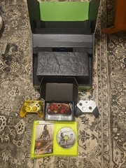 Xbox series x with three controllers in open box. condition