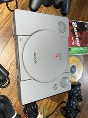 Sony Playstation 1 Gray Console With Games Controllers, A/V Cable, and Power