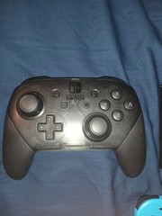 Nintendo Switch console with dock and two controllers