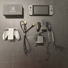 Nintendo Switch with Gray Joycons, Dock, two grips, Straps, Original Power Cable
