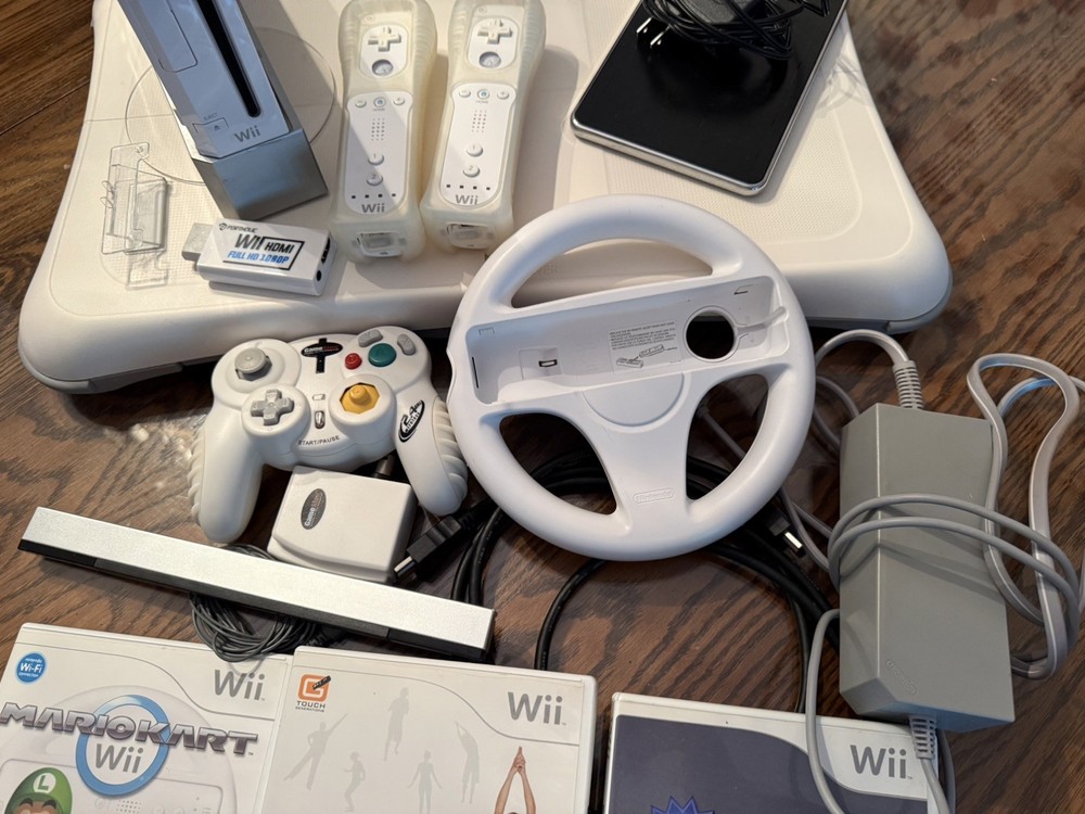 Nintendo Wii Console Bundle with Two Remotes & 3 Games And Wii Fit Board