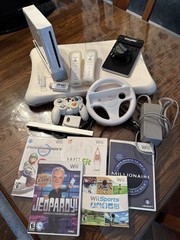 Nintendo Wii Console Bundle with Two Remotes & 3 Games And Wii Fit Board