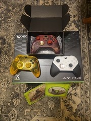 Xbox series x with three controllers in open box. condition