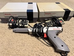 2 NES Systems 2 power cords 1 RF Switch Cable 2 Controller. 39 Different Games.