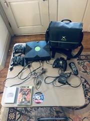 Xbox console, three controllers, carryting case, 2 games, and more