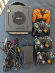 Nintendo GameCube Home Console in Black and four controllers