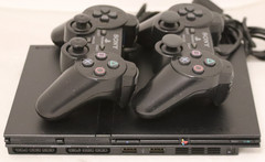 Sony PlayStation 2 Slim (SCPH-75001) W/ two controllers