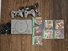 Sony PlayStation 1 with Cables, Controllers, Crash Bandicoot and Spyro Games