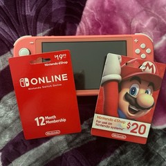 Nintendo Switch Lite Coral Console with eShop $20 Card & Switch Online 12 Month